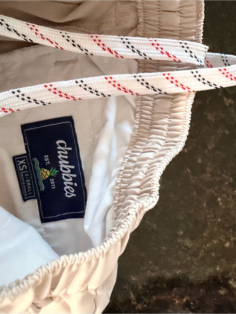 chubbies Kids Beige Swim Shorts with White Lined Waist and Decorative Drawstring